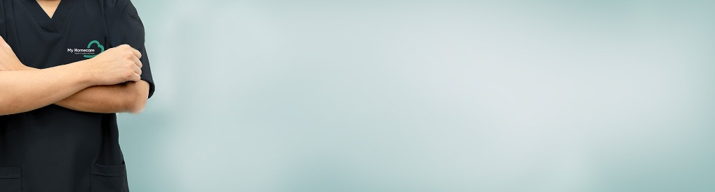 Carer standing with arms crossed